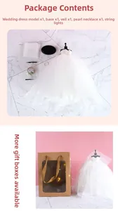 Mini bridal dress model set with lace details, accessories, and a gift box packaging
