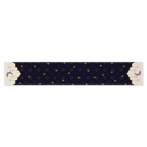 Navy blue and beige table runner with moon and star prints for festive dining decor