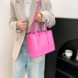 Hot pink minimalist square handbag for women with adjustable crossbody strap and top handle