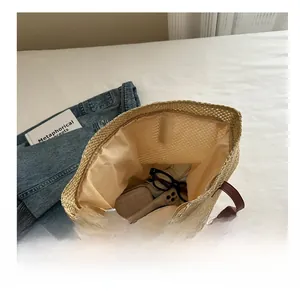 Top view of woven straw tote bag interior showing spacious capacity for daily essentials