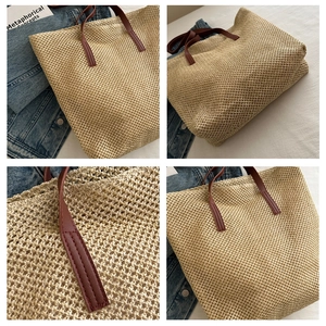 Close-up of beige woven tote bag with brown handles and detailed stitching work