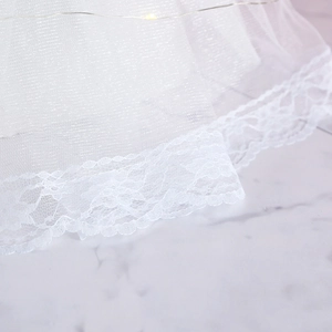 Elegant white wedding dress gift box with lace veil and glowing LED decorative lights