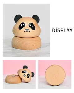 Detail of panda wooden music box showing smooth light wood texture and detachable parts