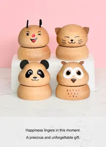 Detailed close-up of handmade wooden animal music boxes including cat and panda designs