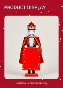 Close-up of wooden nutcracker king with crown holding a Merry Christmas photo frame