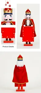 Close-up of 38cm wooden Nutcracker King with Merry Christmas photo frame and velvet cape