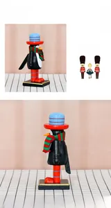 Detail of 16cm penguin nutcracker wooden ornament with blue hat and knitted scarf