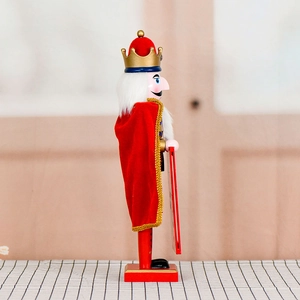 38cm wooden King Nutcracker soldier in red velvet cape with crown, side profile view