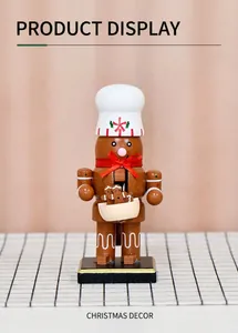 Detail of 16cm wooden chef gingerbread nutcracker with white hat and small cookies