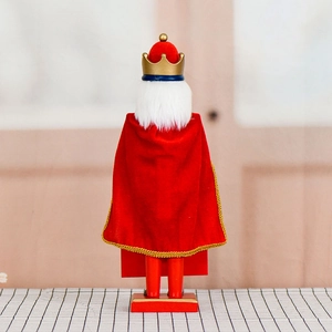 Rear view of a 38cm wooden King Nutcracker doll with a red velvet cape for Christmas decor