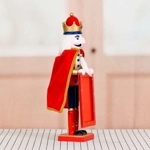 38cm wooden King Nutcracker soldier in red velvet cloak holding a Merry Christmas frame