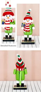Detail of wooden snowman nutcracker with knitted scarf and hat for Christmas decor