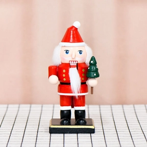 16cm wooden Santa Claus nutcracker figurine holding a mini tree on a black base