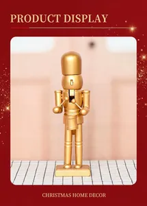 Close-up of golden wooden nutcracker soldier drummer with matte metallic finish