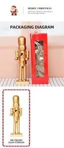 Detailed view of a 25cm golden nutcracker soldier with red festive window gift box