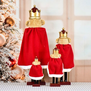 Set of 4 bear nutcracker figurines in red capes with gold crowns and festive lights