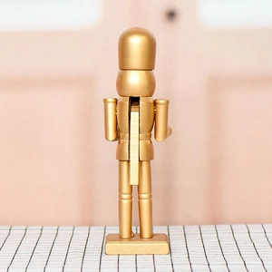 Golden 25cm wooden nutcracker soldier ornament with back lever detail for Christmas