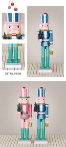 Detail of pink and blue glitter nutcracker wooden soldiers with mini Christmas trees