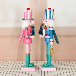 Pink and blue 38cm wooden nutcracker soldiers with glitter and mini Christmas trees