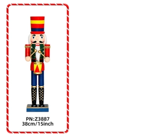 Detail of 38cm wooden nutcracker drummer in red and green uniform with drum and gold sticks