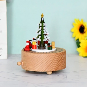 Wooden Christmas music box with rotating base featuring Santa, snowman and festive tree
