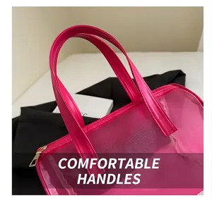 Detailed shot of comfortable hot pink mesh tote handles and fine stitching quality