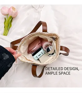Close-up of straw beach bag interior showing large capacity and smooth fabric lining