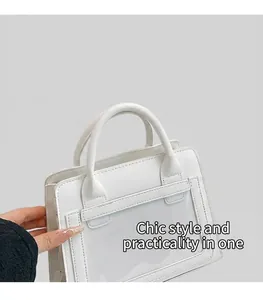 Detail of white large capacity tote bag featuring transparent stitching on fabric