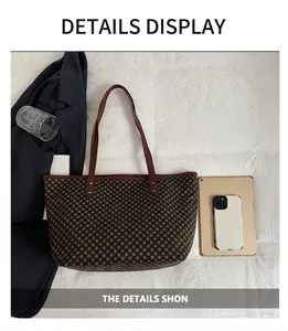 Detailed top view of large checkerboard tote bag with laptop and business essentials