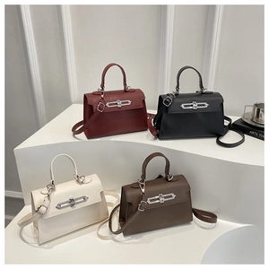 Kelly style mini leather handbags in burgundy, black, cream, and coffee on white stands