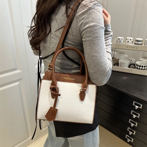 Women's color-block crossbody bag in white and brown leather with cylindrical handles