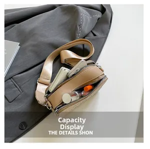 Detailed interior capacity view of beige crossbody bag with phone and cosmetics
