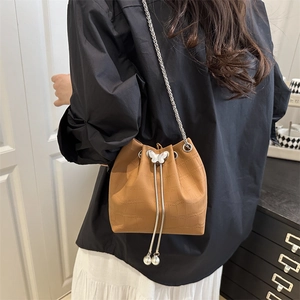 Brown crocodile texture bucket bag with silver butterfly charm and chain strap for women