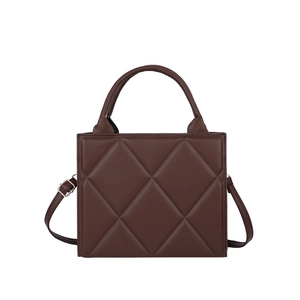 Dark brown quilted tote bag with a minimalist diamond pattern and adjustable strap