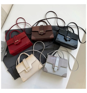 Flat lay of five faux crocodile texture tote bags in assorted elegant colors for women
