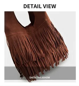 Close-up of bohemian brown faux suede tote bag featuring dense tassel fringe detail