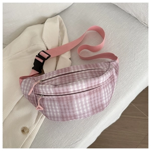 Close-up of pink and purple corduroy waist bag texture with black plastic buckle