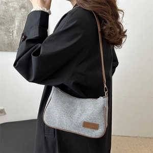 Retro grey woven shoulder bag with brown leather trim and fashion square label detail