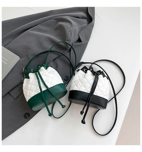 Detail view of quilted bucket bags with contrast patchwork and drawstring closure design