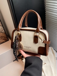 Retro color-block Boston handbag in cream and brown with tennis racket charm