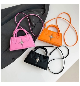 Schicke Mini-Taschen in Pink Orange und Schwarz mit silbernem Stern und Riemen
