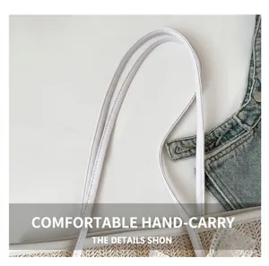 Detail of soft white faux leather handles and woven straw texture on tote bag