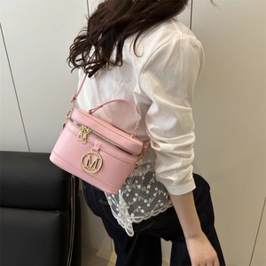 Pink retro box handbag with gold letter logo, crossbody vanity case style for women