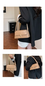 Detail view of khaki baguette shoulder bag with golden twist lock and smooth leather texture