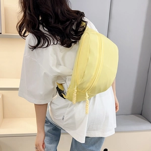 Minimalist bright yellow nylon crescent crossbody bag with adjustable wide shoulder strap