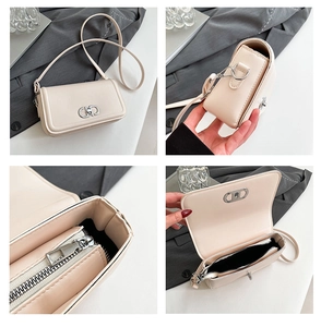 Detail view of the beige crossbody bag showing interior zipper pocket and metal buckle