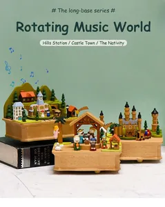 Detailed view of rotating wooden music boxes with hand-painted miniature scenery