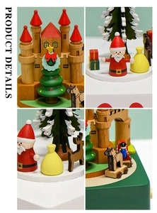 Dettaglio di carillon natalizio in legno artigianale con Babbo Natale e renne in miniatura