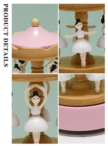 Détail de la boîte à musique ballerine en bois rotative avec accents roses peints