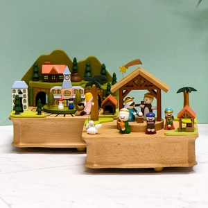 Handcrafted wooden music boxes featuring nativity and town scene themes for home decor